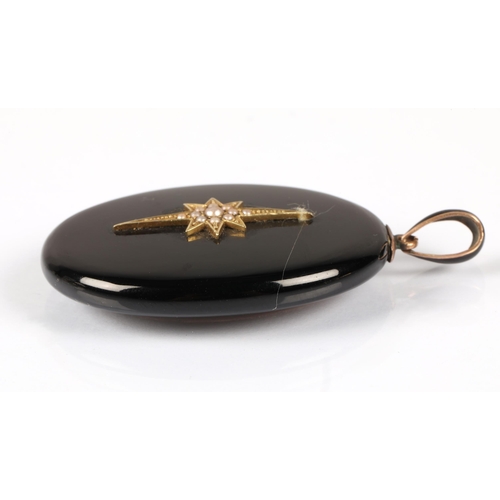 162 - Black enamel mourning pendant mounted with a yellow metal star set with seed pearls