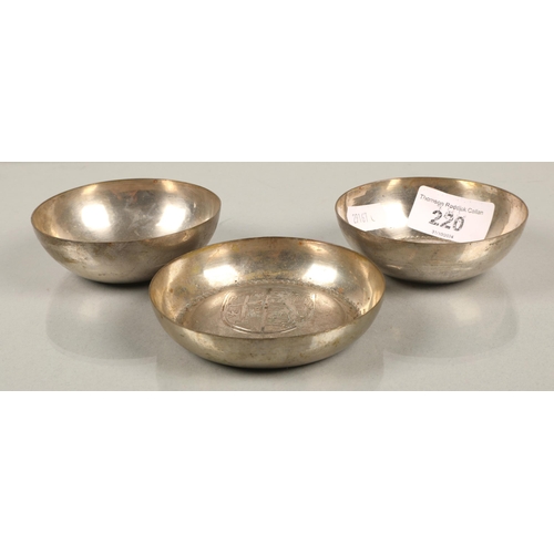 220 - Three white metal bowls with heraldic designs, 126g