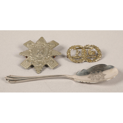 229 - Two Black Watch cap badges & Black Watch silver spoon, Sheffield 1911