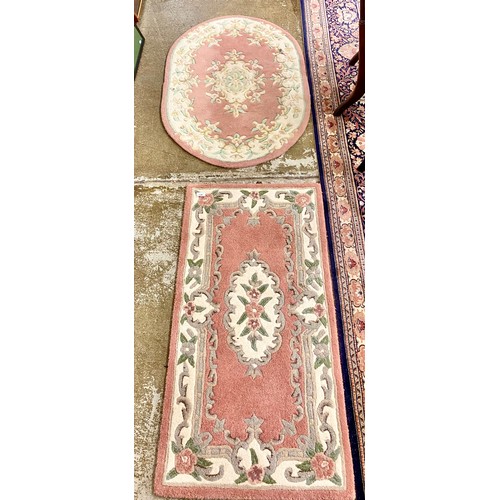 628 - Two floral floor rugs