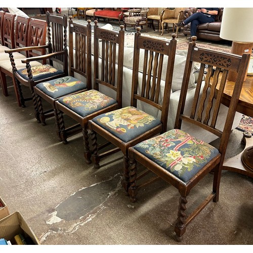 680 - Five oak floral upholstered dining chairs (one carver)