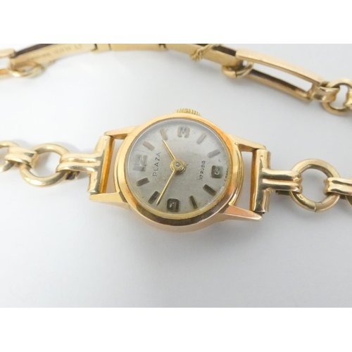 101 - Lady's Plaza gold watch '18k' on 9ct bracelet. 10g gross