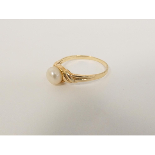 104 - Pearl ring in 9ct gold, a silver cross and chain and a silver rattle