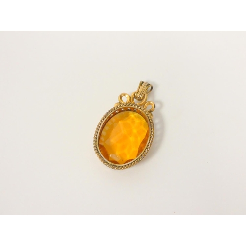 112 - Victorian citrine paste pendant in gold corded mount