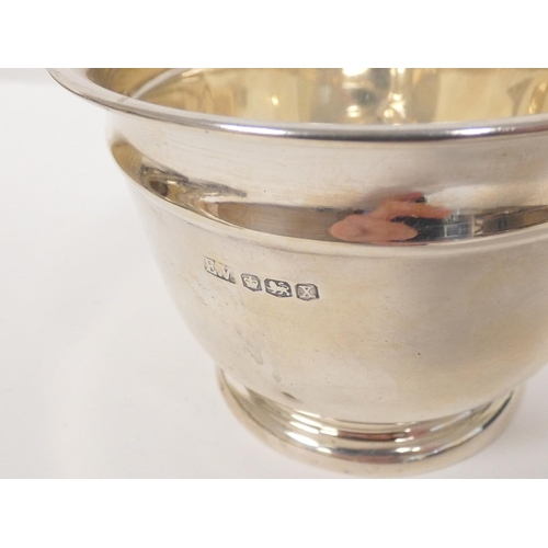 121 - Silver plain bowl, three napkin rings (115g), also six mounted toilet items.