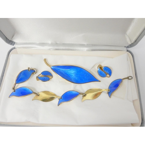 78 - Norwegian silver gilt and blue enamel leaf brooch, with bracelet and earrings