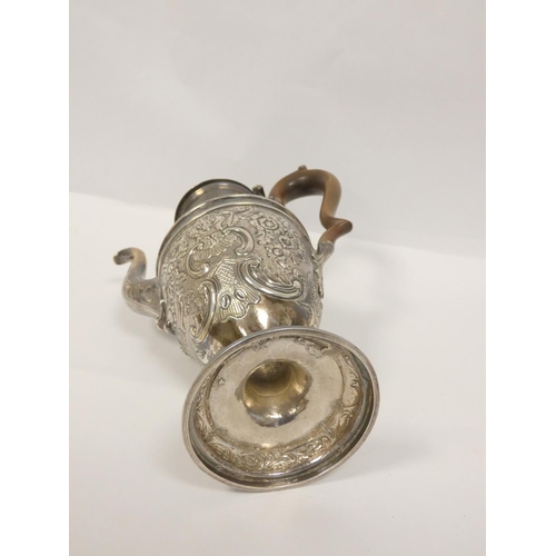 80 - Georgian silver embossed coffee pot of vase form, crested, apparently unmarked C1770. 745g.