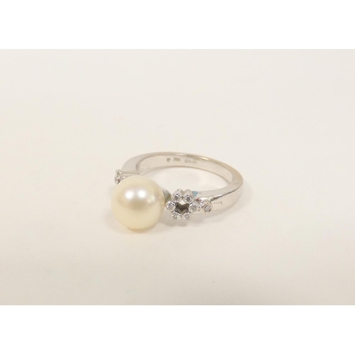 81 - Pearl ring with diamond set shoulders in 18ct white gold. Size 'M' 5g gross