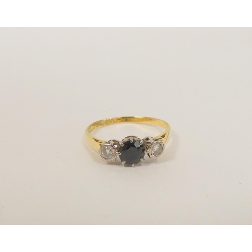 90 - Diamond and sapphire three-stone ring in 18ct gold. Size 'T', 2.8g