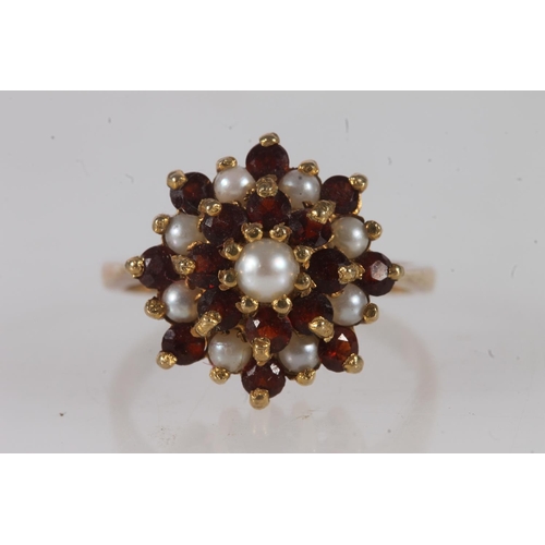 597 - 9ct gold seed pearl and garnet dress ring, size M, 3.2g.