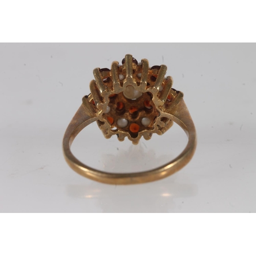 597 - 9ct gold seed pearl and garnet dress ring, size M, 3.2g.