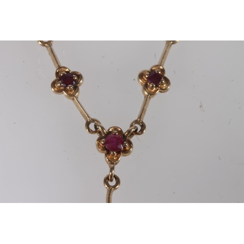 603 - 9ct gold garnet set necklace, 3.7g gross.