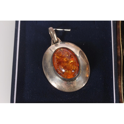 614 - 9ct rolled gold bangle in Stoddart & MacMillan jewellery box, a silver and amber pendant, a pair... 