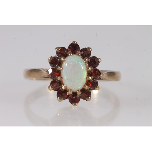 629 - 9ct gold opal and garnet flowerhead ring, size O, 2.7g.