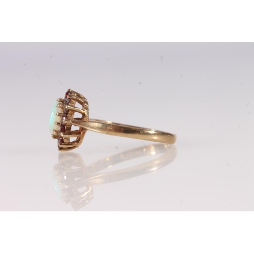 629 - 9ct gold opal and garnet flowerhead ring, size O, 2.7g.