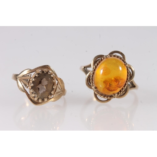 630 - 9ct gold ring set with cabochon amber stone, size Q, 2.9g and another 9ct gold ring 1.7g. (2)