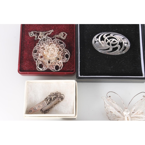 638 - Silver and other white metal filigree jewellery to include butterfly brooch, spiders web brooch, flo... 