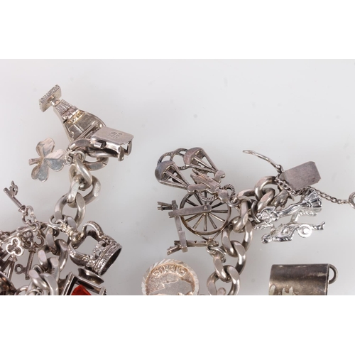 655 - Silver curb link charm bracelet and various charms, 92g gross.