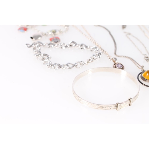 687 - Mixed grade silver jewellery to include a half engraved bangle, baby's bangle, neck chains, bracelet... 