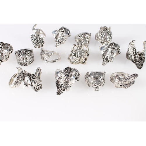 695 - Thirteen white metal animal themed dress rings to include lion, peacock, crocodile, dragon etc.