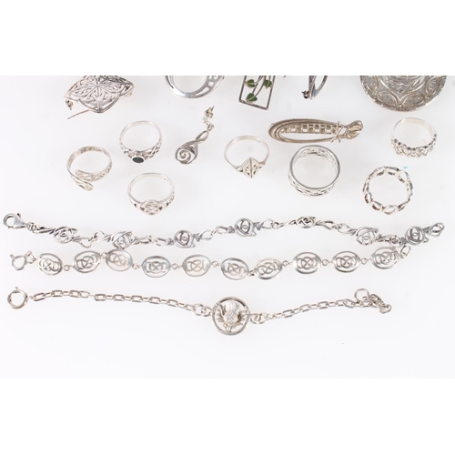 696 - Scottish and Celtic inspired silver and white metal jewellery to include a Glasgow silver longship b... 