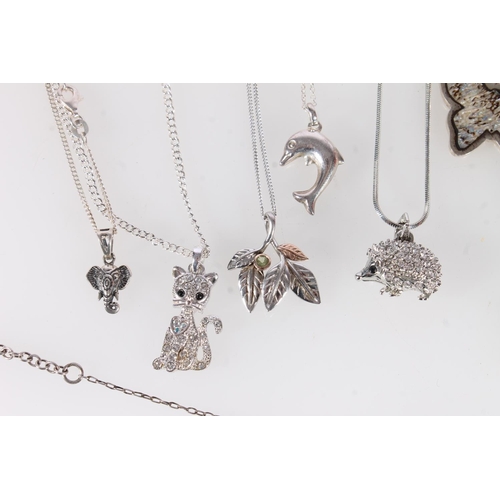 715 - Twelve flora and fauna themed pendant necklaces, some silver.