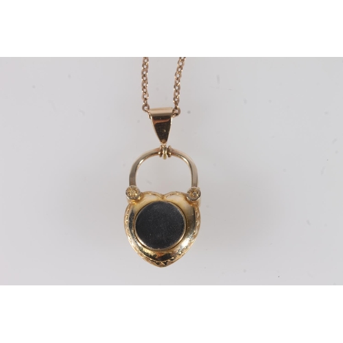 754 - Victorian yellow metal mourning locket set with opals and rubies, unmarked, on plated chain.