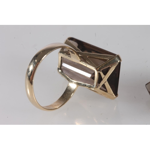 758 - 9ct gold smoky topaz dress ring, 7.1g gross and a smoky topaz unmounted stone. (2)