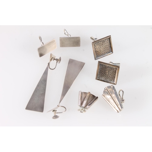 763 - Modernist silver jewellery to include three pairs of cufflinks, a pair of earrings and a box link ch... 