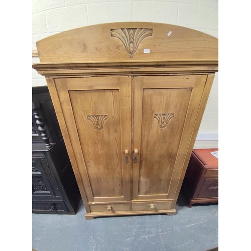 439 - Art Deco continental pine two drawer wardrobe having two small drawers and carved Egyptian lotus flo... 