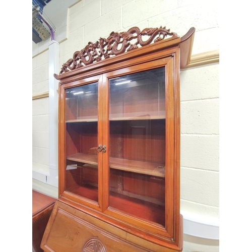 443 - 20th century Chinese rosewood bureau bookcase with carved dragon pediment, the fall front carved wit... 