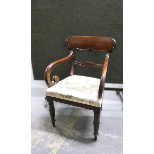 449 - Regency carved mahogany carver chair with stuff over seat raised on turned  supports  Height 90cm.