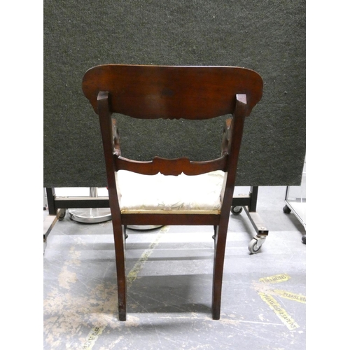 449 - Regency carved mahogany carver chair with stuff over seat raised on turned  supports  Height 90cm.