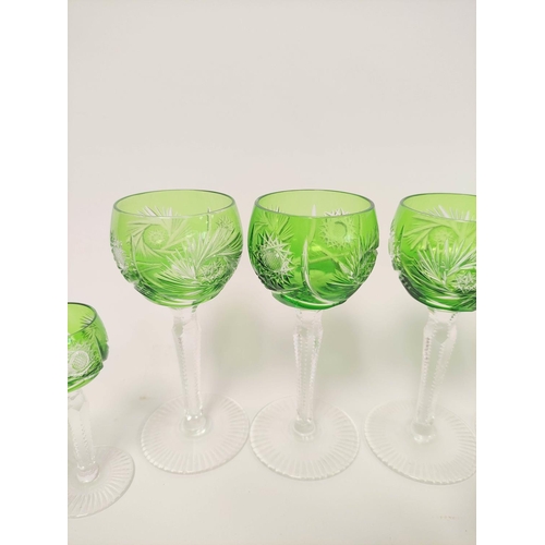 300 - Six green flashed faceted wine glasses along with six liqueur glasses of similar style. (12)