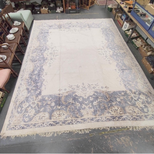 396 - Chinese style muted silk and wool carpet with central white floral panel encircled by a blue and bro... 