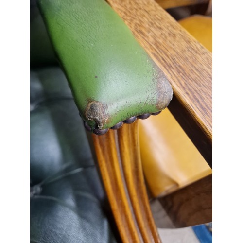 641 - Chesterfield-style green leather swivel chair 