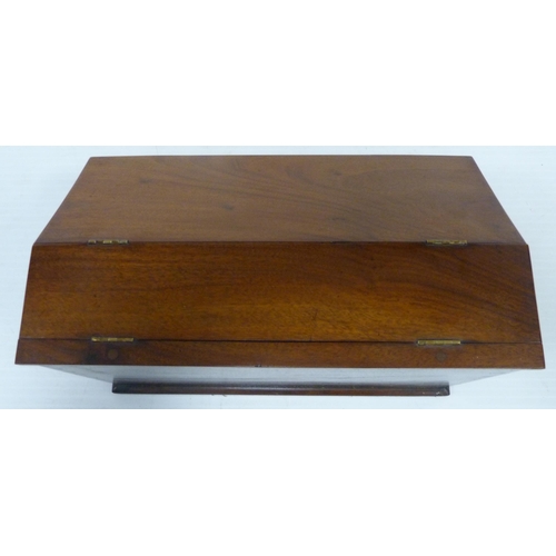 395 - Victorian mahogany stationery box with hinged sloping front cover enclosing fitted compartments, 23.... 