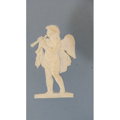 319 - Two pâte-sur-pâte tiles, c. 1885, decorated with Cupid with trap and Cupid playing a lute, on salmon... 