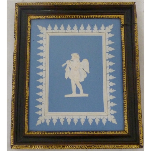 319 - Two pâte-sur-pâte tiles, c. 1885, decorated with Cupid with trap and Cupid playing a lute, on salmon... 