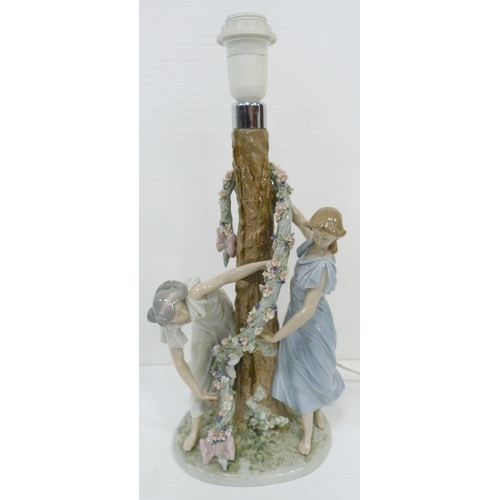 326 - Lladro lamp base in the form of two maidens decorating a tree with a floral garland, impressed no. 1... 