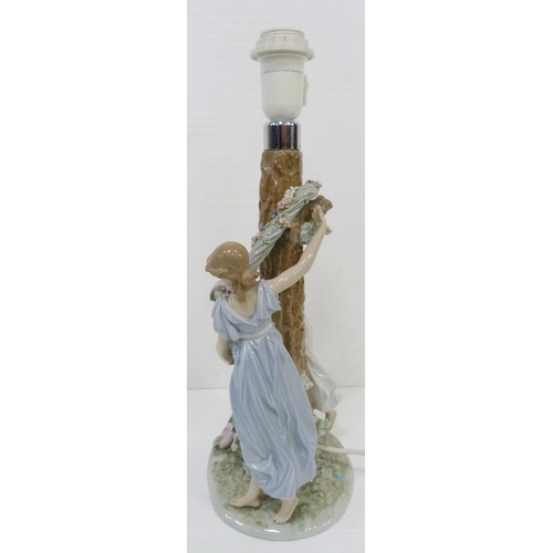 326 - Lladro lamp base in the form of two maidens decorating a tree with a floral garland, impressed no. 1... 