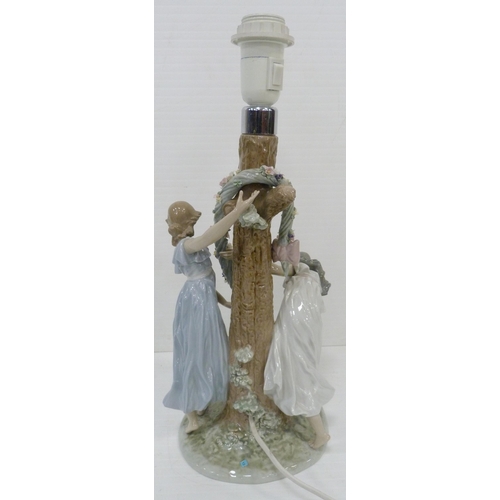 326 - Lladro lamp base in the form of two maidens decorating a tree with a floral garland, impressed no. 1... 