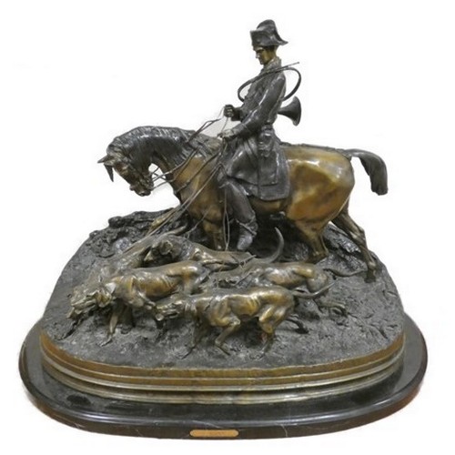 After P.J. Mene (French, 1810-1879) 'Valet De Chasse', a very large patinated cast bronze equestrian figure group, 20th century, the huntsman up with five hounds at bay on an oval rocky base bearing the legend P.J Mene 1869. Height 66cm, Width 83cm.