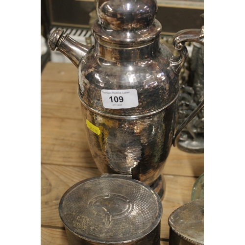 109 - Silver-plated water jug, glass flasks, etc.