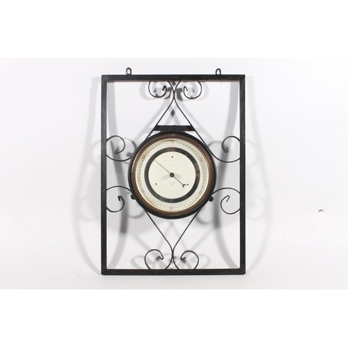 11 - J H Steward compensated barometer on metal frame.