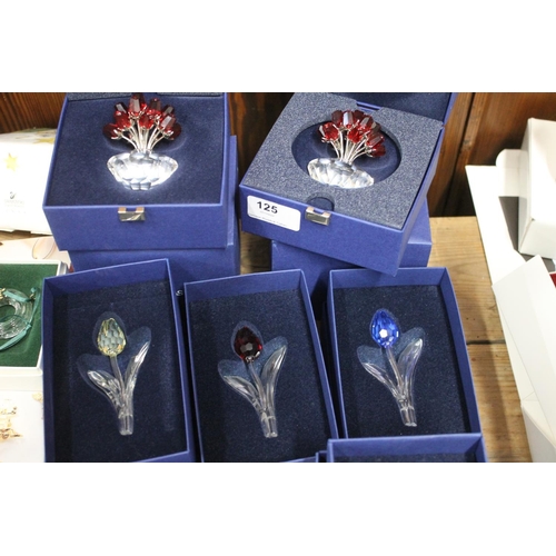 125 - Eight Swarovski Crystal glass flower ornaments to include 283394 Vase of Roses, 600347 Tulip etc and... 