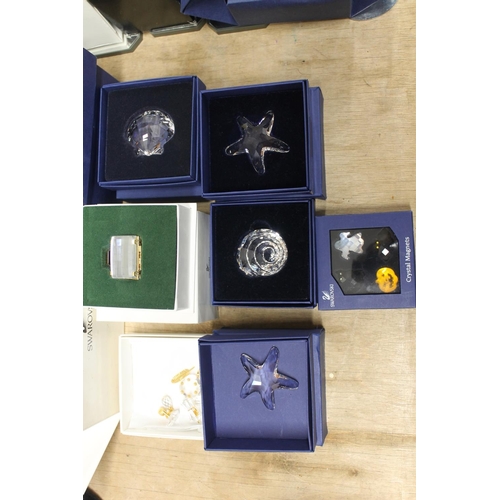 135 - Swarovski Crystal SCS, to include Planet Vision 2000, flower, starfish etc. each boxed.