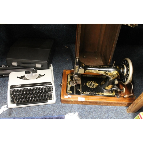 139 - Singer sewing machine and a Silver-Reed SR100 Tabulator typewriter.