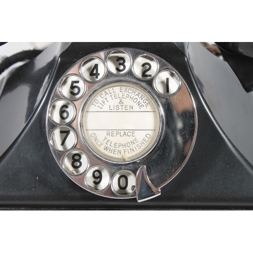 16 - Vintage black Bakelite telephone.