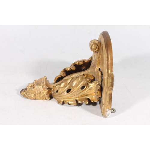 176 - Gilt wall sconce with devil mask and acanthus leaf ornament.